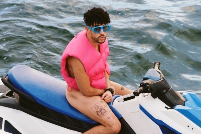 a man sitting on a boat in the water