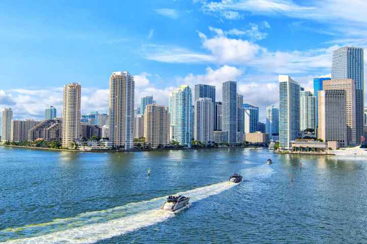 a body of water with city of miami in the background