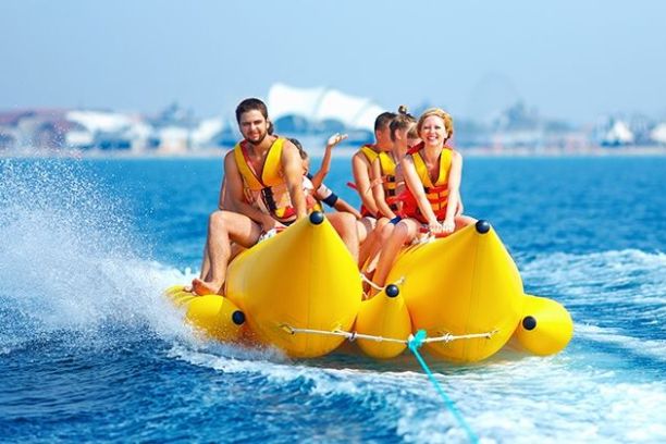 a person riding on the back of a boat in the water