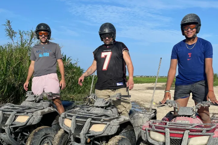 a couple of people that are standing in the dirt