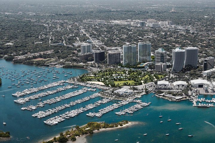 a body of water with a city in the background